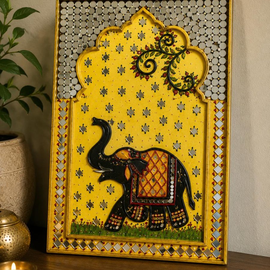 Rajasthan Pichwai art panel in yellow with mirror work and a hand-painted decorated elephant, in a gold arched frame